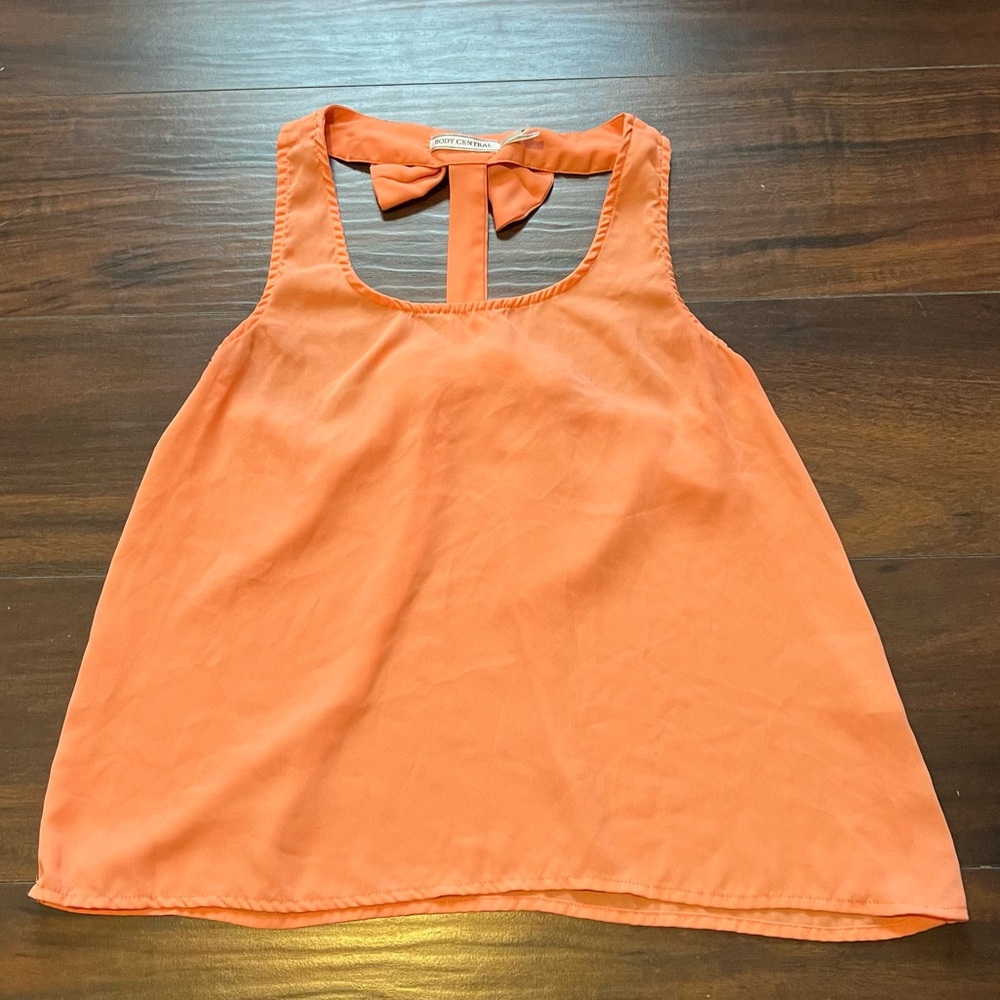 Orange tank top with those down the back size medium